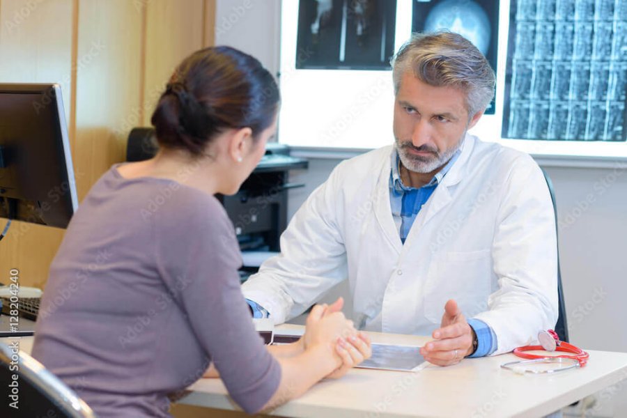 Doctor speaking with a patient during a consultation in a medical office